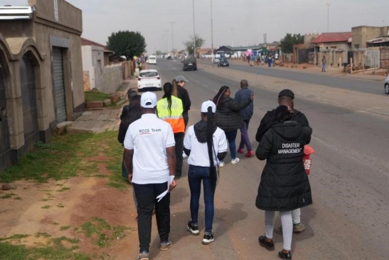 Volunteers on their way to distribute evacuation fliers