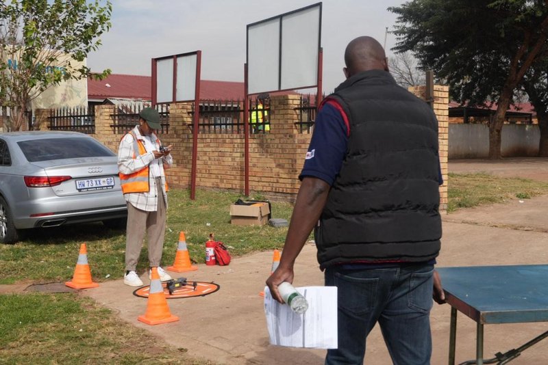 Drone pilot monitoring activity in the community